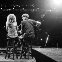 James Taylor serenades Bonnie Raitt in the final number of the night at Wrigley Field.